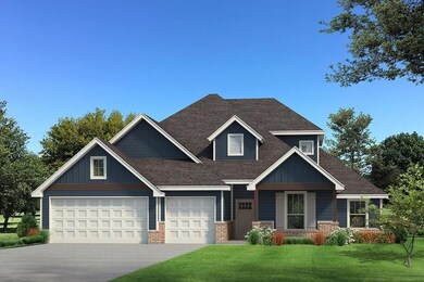 Craftsman-style house with a front lawn and a gara