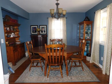 Separate dining room with hardwood floors