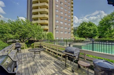 Wooden terrace featuring a fenced in pool and a gr