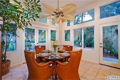 DINING SPACE WITH CEILING FAN AND NATURAL LIGHT