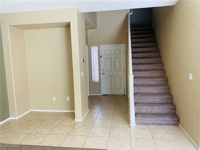 Entrance foyer featuring light tile patterned floo