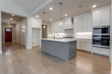 Kitchen with light hardwood / wood-style flooring,