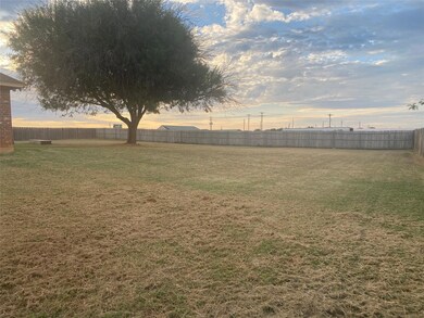 View of yard at dusk