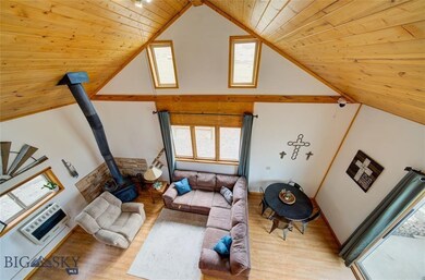 View of living room from loft - Large window has s