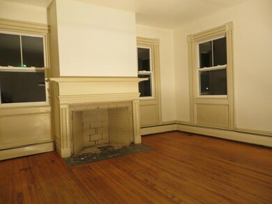 Living room with hardwood floor. ...