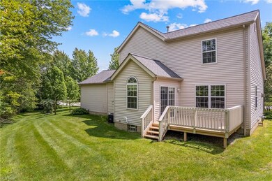Back of condo with recently stained deck