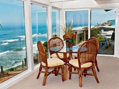 Private balcony with panoramic ocean views is visi