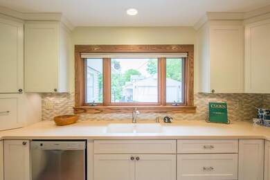 Kitchen with views of backyard