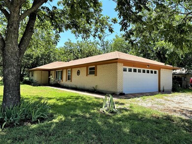 GARAGE IS AT WEST SIDE OF HOME