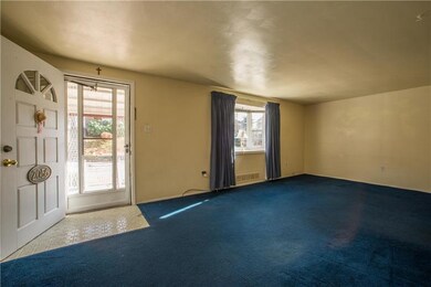 The front door opens into the living room, measuri