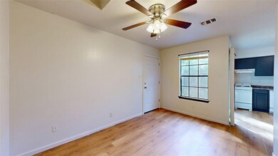 Empty room featuring light wood finished floors an