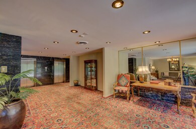 Living room featuring a notable chandelier and car