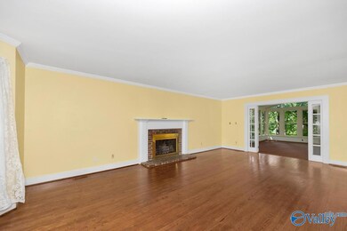 Living room leads to huge sun room