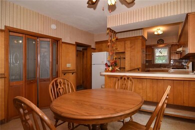 Pantry doors open to fist level laundry