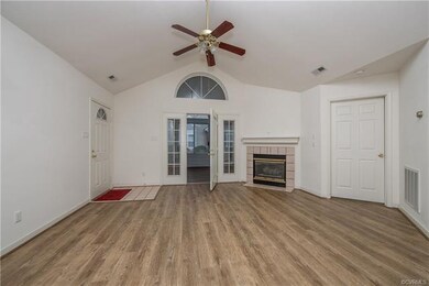 Great Room with cathedral ceiling and door to Flor