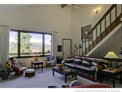 Living Room. Stairs lead to the sleeping loft and