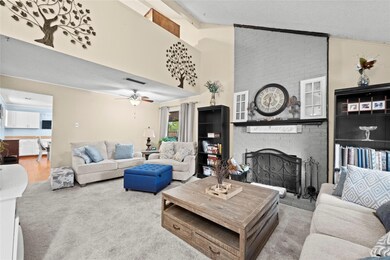Living room featuring carpet flooring, ceiling fan