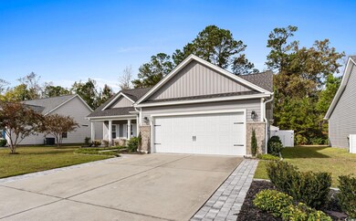 Craftsman-style home with cooling unit, a garage, 