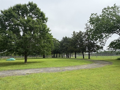Surrounding community featuring a lawn and fence