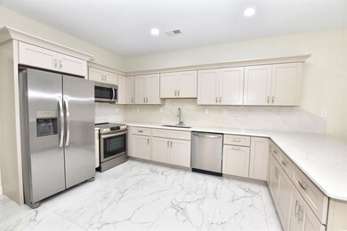 Kitchen with appliances with stainless steel finis