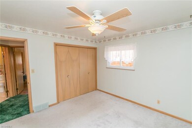 Bedroom has wood floors under carpet