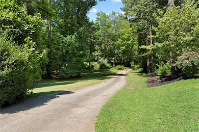 View of street featuring a wooded view