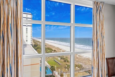 Interior space with a water view and a beach view