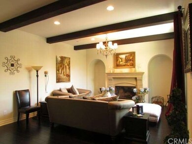 Front Entrance Opens to Beamed Living Room and Fir