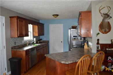Plenty of cabinet space in the kitchen. Room for 2 chairs at the bar.