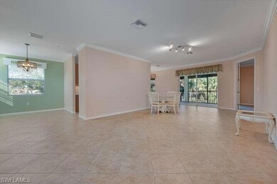 Spare room featuring crown molding, light tile pat