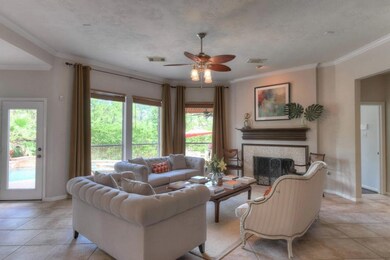 Large windows overlook the backyard and allow natural light to fill the family room, cozy fireplace with wood mantle and custom tile surround complete the picture.