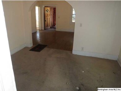 Dining room with living room in background