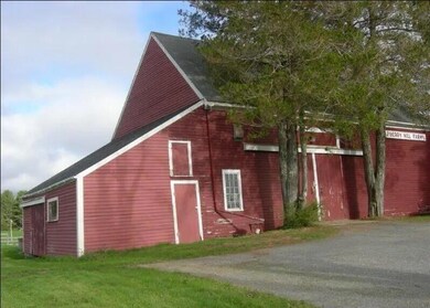 Barn with potting under shed roof.
