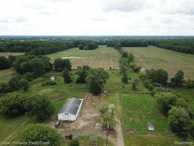 25 acres! W/ 32 x 64 Cement Pole barn, 3 Garages,