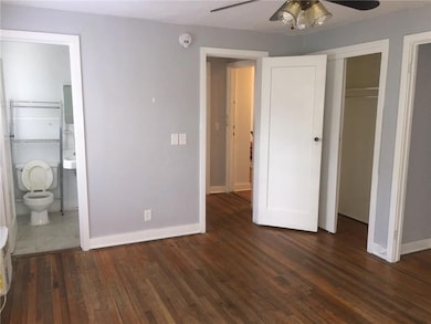 Unfurnished bedroom featuring wood finished floors