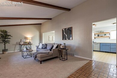 Foyer into the family room with kitchen straight a