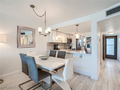Dining area with light wood-type flooring and an i