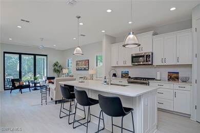 Kitchen with stainless steel appliances, a sink, v