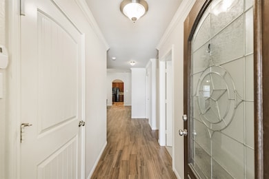 Beautiful front door and gorgeous wood-look tile.