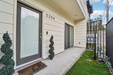 First floor front door is gated and opens to a sid