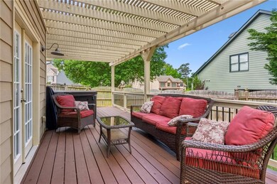 Deck with an outdoor living space, a pergola, a fe