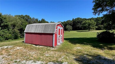 Storage shed allows extra space for mowers and out
