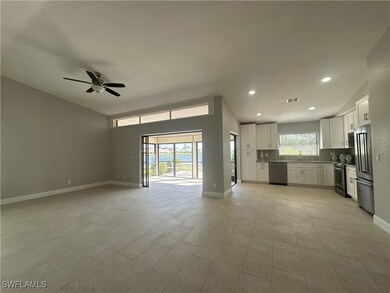 Kitchen with sink, ceiling fan, appliances with st