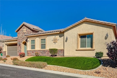 Mediterranean / spanish-style house featuring a ti