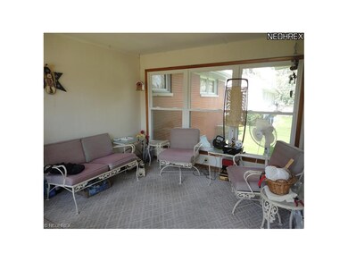 Attached sun porch with new windows.