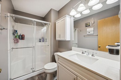 View of the private 3/4 bath located in the primary bedroom. Bathroom was updated in 2022.