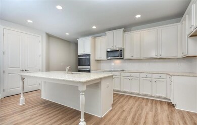 Kitchen with light hardwood / wood-style flooring,