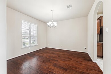 This photo shows a bright dining room with rich en