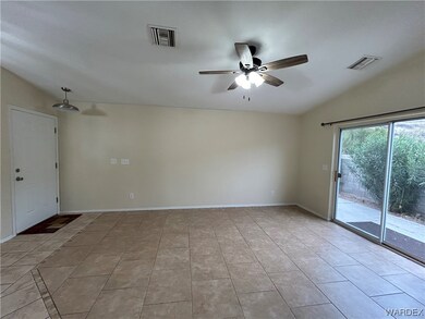 Unfurnished room with lofted ceiling, ceiling fan,