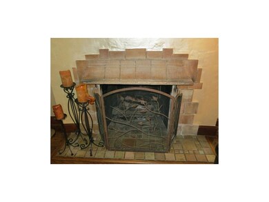 Enchanting fireplace with stone mantle.